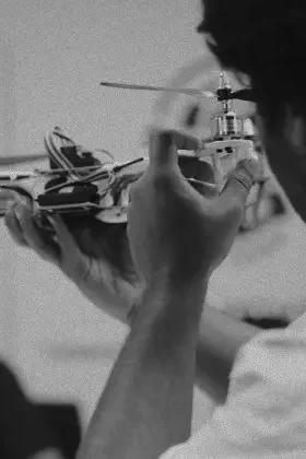 A student holding a drone