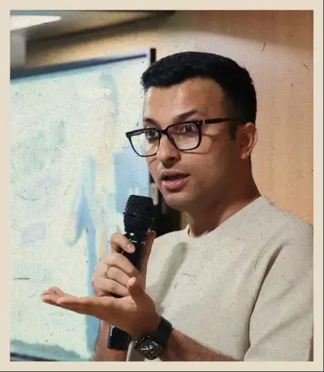 Aashish Solanki speaking to the batch at orientation week